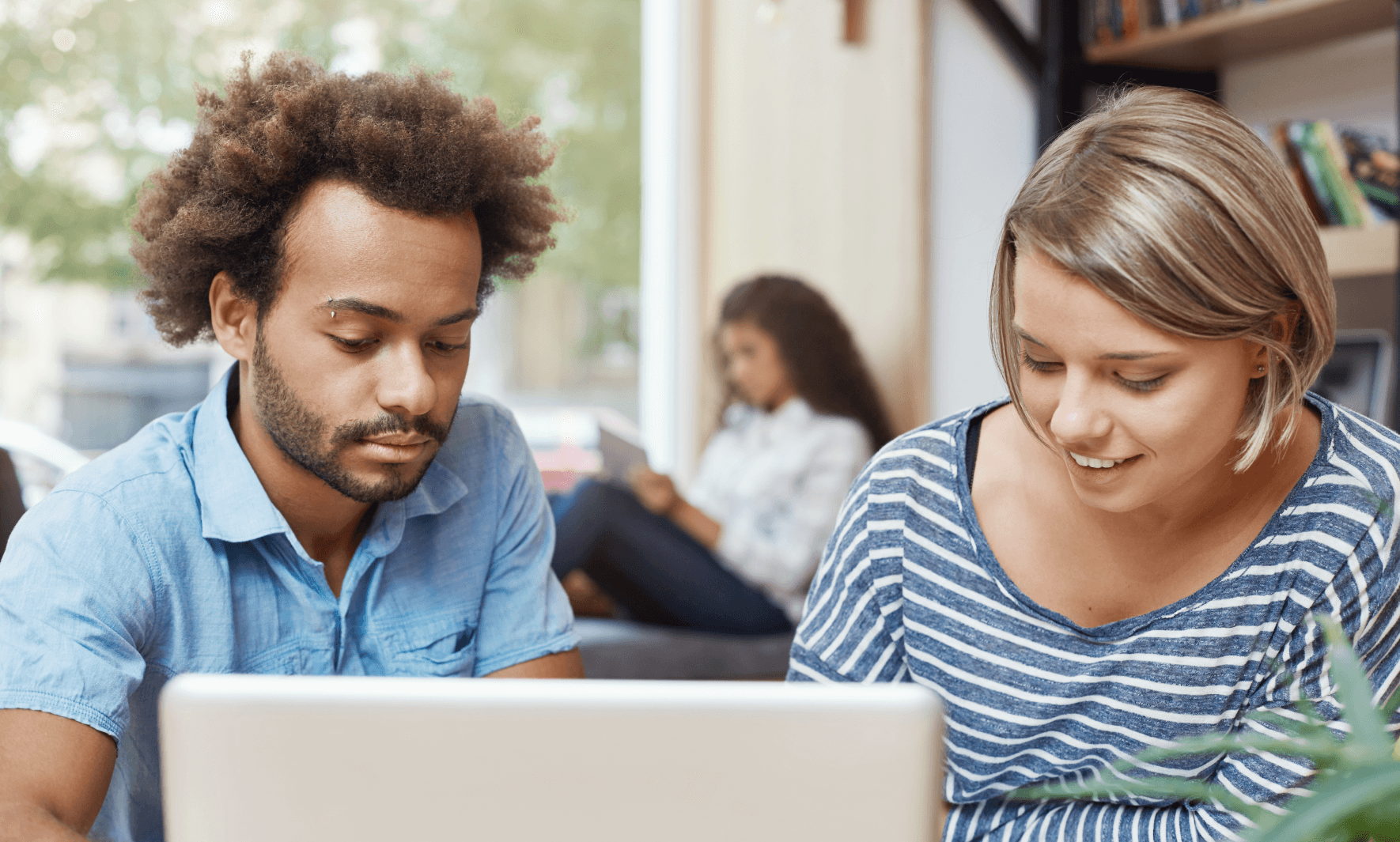 young-woman-laying-on-the-grass-working-on-laptop-students-studying-university